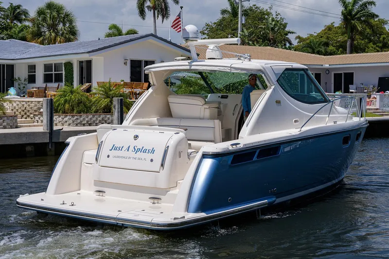  Yacht Photos Pics 2013 Tiara Yachts 3900 Sovran, "Just A Splash," docked near a waterfront home.