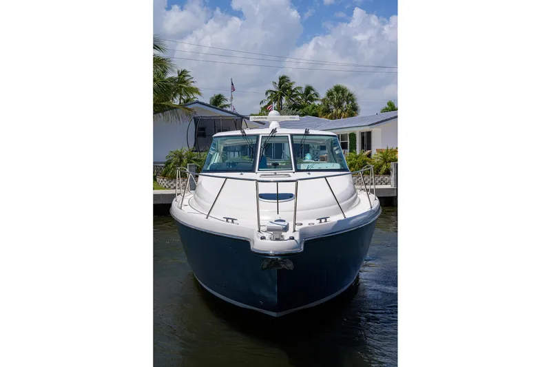  Yacht Photos Pics 2013 Tiara Yachts 3900 Sovran docked, front view with clear sky background.