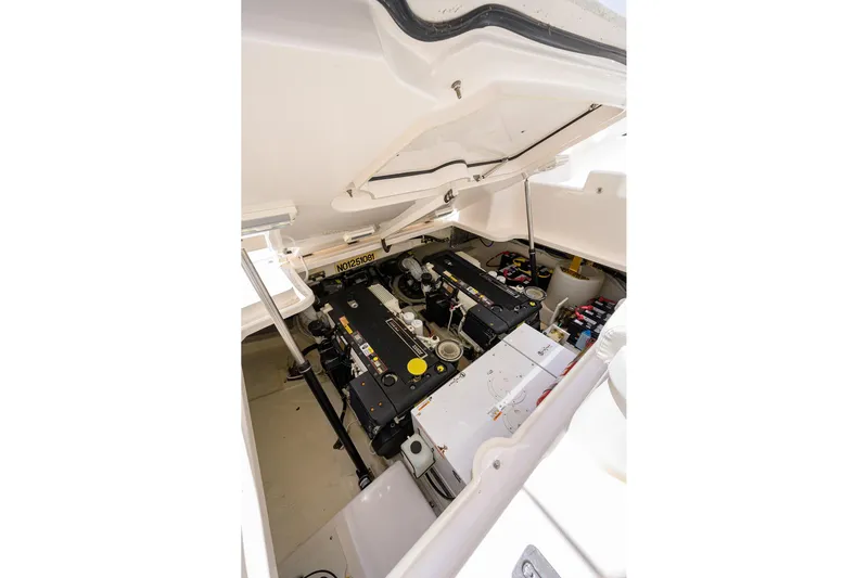  Yacht Photos Pics Engine compartment of 2013 Tiara Yachts 3900 Sovran, showcasing mechanical components and layout.