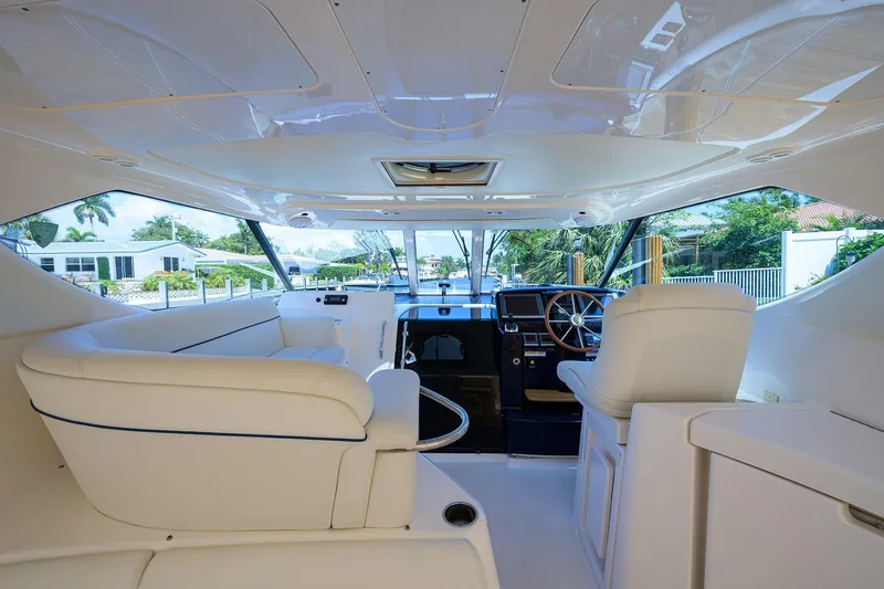  Yacht Photos Pics Interior of 2013 Tiara Yachts 3900 Sovran, featuring luxurious seating and helm.