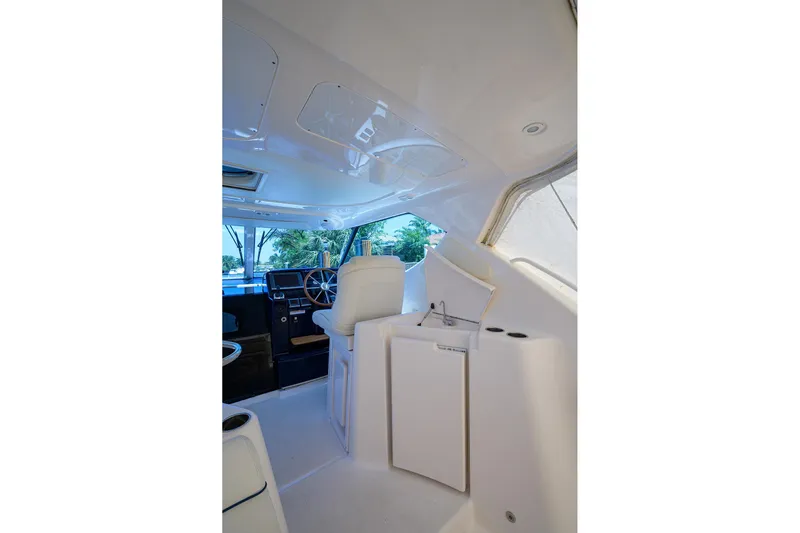  Yacht Photos Pics Interior of 2013 Tiara Yachts 3900 Sovran, featuring helm and seating area.