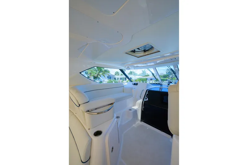  Yacht Photos Pics Interior of 2013 Tiara Yachts 3900 Sovran, featuring sleek white seating and windows.