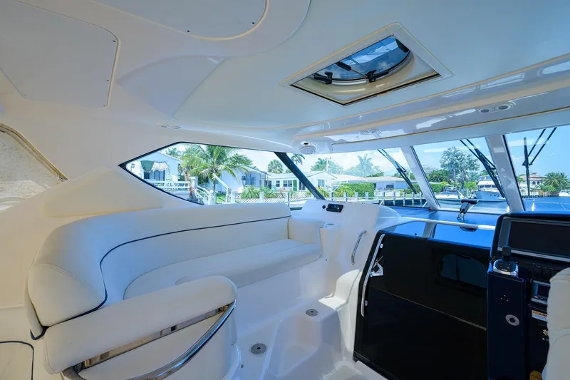 Yacht Photos Pics 2013 Tiara Yachts 3900 Sovran interior with white seating and panoramic windows.