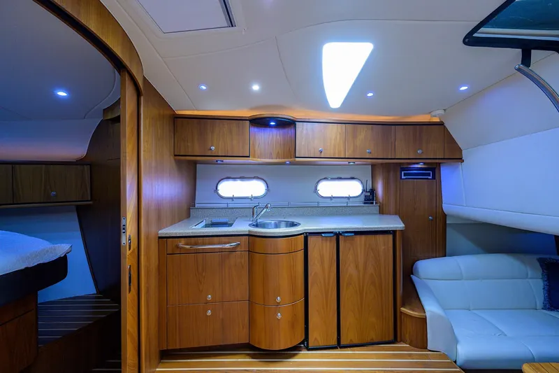  Yacht Photos Pics Interior of 2013 Tiara Yachts 3900 Sovran, featuring a modern kitchen and cozy seating area.
