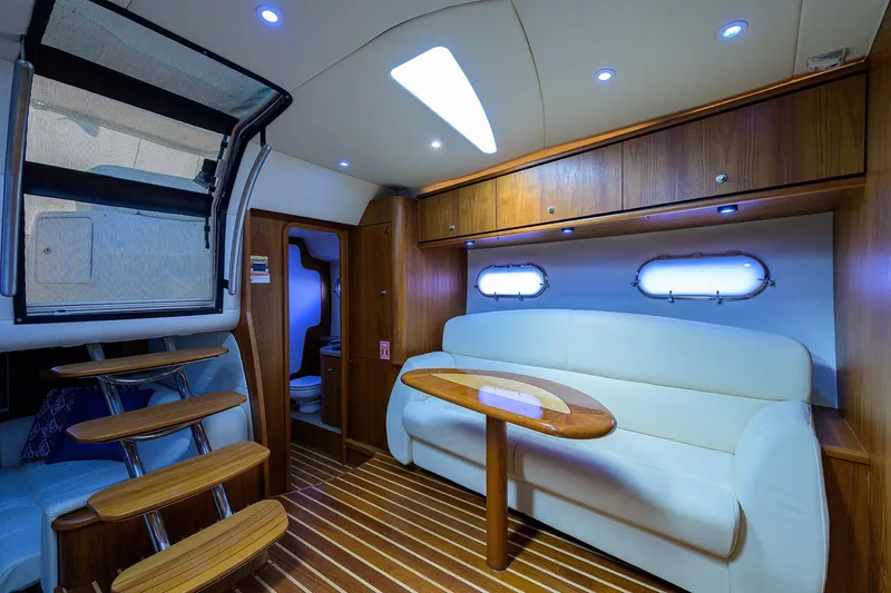  Yacht Photos Pics Luxurious interior of 2013 Tiara Yachts 3900 Sovran with elegant seating and wooden accents.