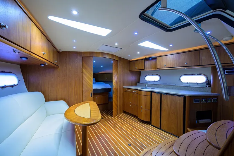  Yacht Photos Pics Luxurious interior of 2013 Tiara Yachts 3900 Sovran with wood finishes and modern amenities.