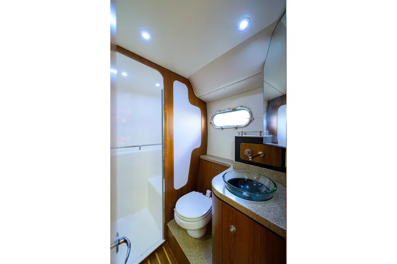  Yacht Photos Pics Luxurious bathroom in 2013 Tiara Yachts 3900 Sovran, featuring modern fixtures and elegant design.