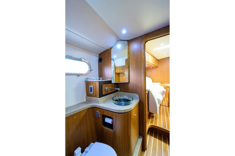  Yacht Photos Pics Luxurious 2013 Tiara Yachts 3900 Sovran bathroom with wood accents and modern fixtures.