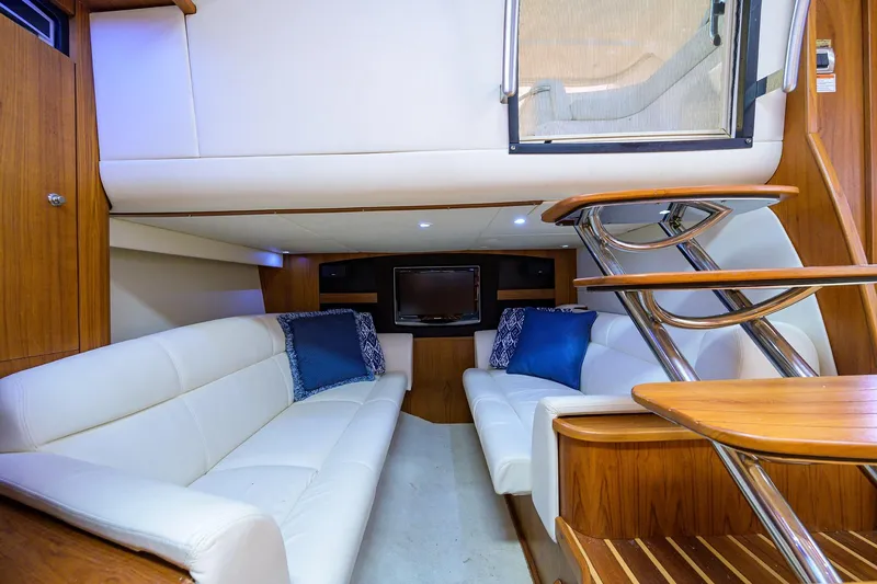  Yacht Photos Pics Interior of 2013 Tiara Yachts 3900 Sovran with white seating and wooden accents.