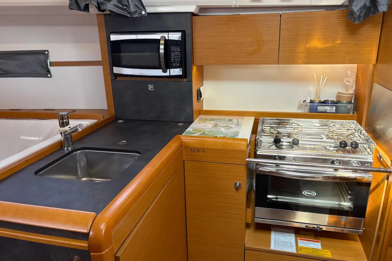 Alpha-joy Yacht Photos Pics Galley, fridge, stove, storage and microwave