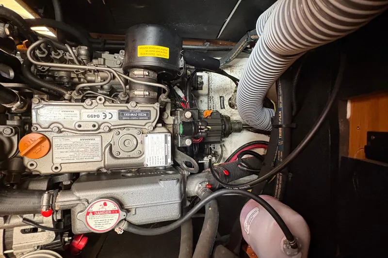 Alpha-joy Yacht Photos Pics Engine compartment of a 2017 Jeanneau Sun Odyssey 349 sailboat, showcasing mechanical components.