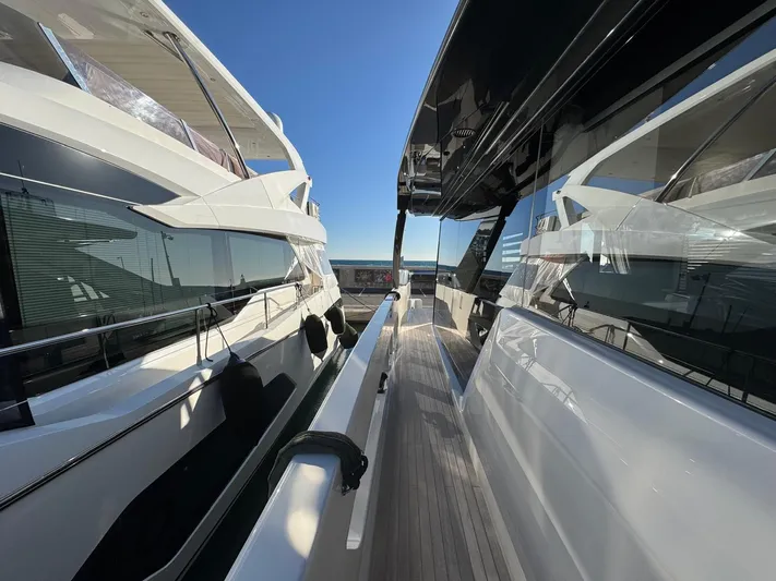  Yacht Photos Pics 2022 Bluegame BGX70 yacht docked, showcasing sleek design and modern architecture.