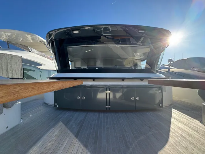  Yacht Photos Pics 2022 Bluegame BGX70 yacht deck with modern design under bright sunlight.