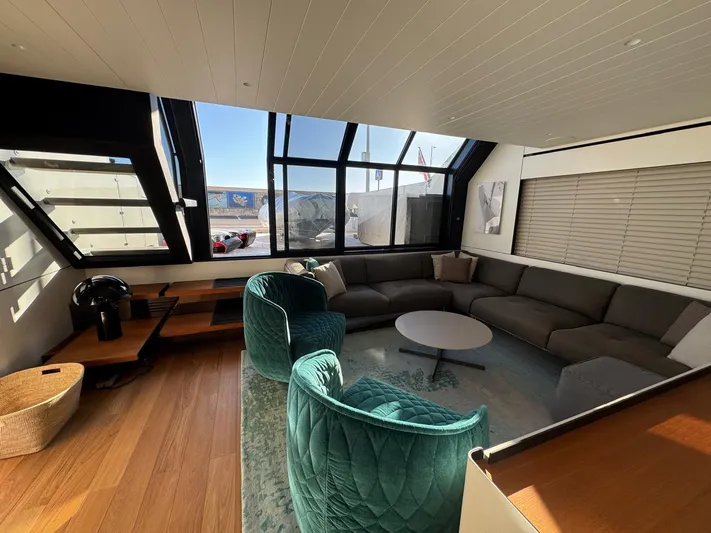  Yacht Photos Pics Luxurious interior of 2022 Bluegame BGX70 yacht with modern seating and large windows.