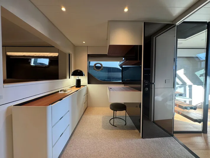  Yacht Photos Pics Luxurious interior of 2022 Bluegame BGX70 yacht with modern furnishings and sleek design.