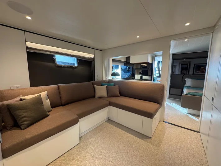  Yacht Photos Pics Luxurious interior of 2022 Bluegame BGX70 yacht with modern seating and elegant design.
