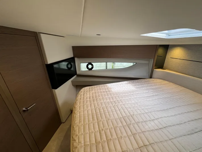  Yacht Photos Pics Luxurious bedroom interior of 2023 Princess V50 Open yacht, featuring modern design and elegant finishes.