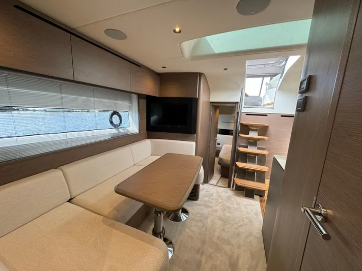  Yacht Photos Pics Luxurious interior of 2023 Princess V50 Open yacht with modern seating and elegant design.