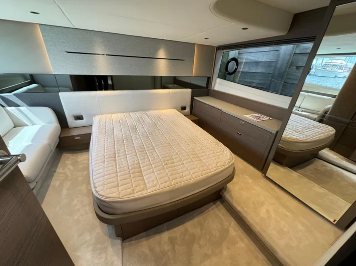  Yacht Photos Pics Luxurious bedroom interior of 2023 Princess V50 Open yacht with modern design and elegant furnishings.