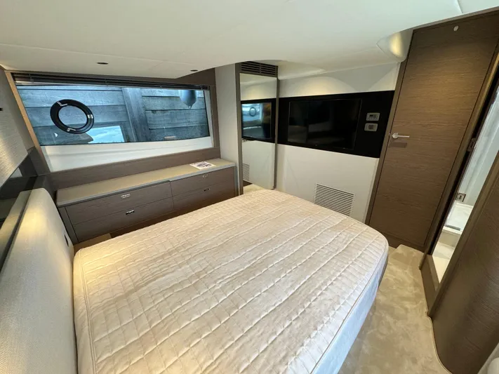  Yacht Photos Pics Luxurious bedroom interior of 2023 Princess V50 Open yacht with modern design.