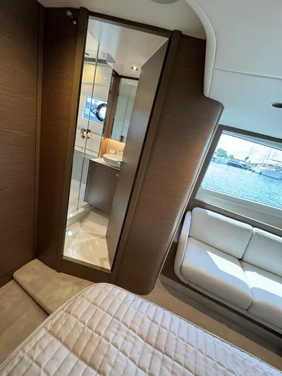  Yacht Photos Pics 2023 Princess V50 Open yacht interior with luxurious bedroom and bathroom view.
