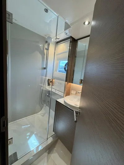  Yacht Photos Pics Modern bathroom in 2023 Princess V50 Open yacht with glass shower enclosure.