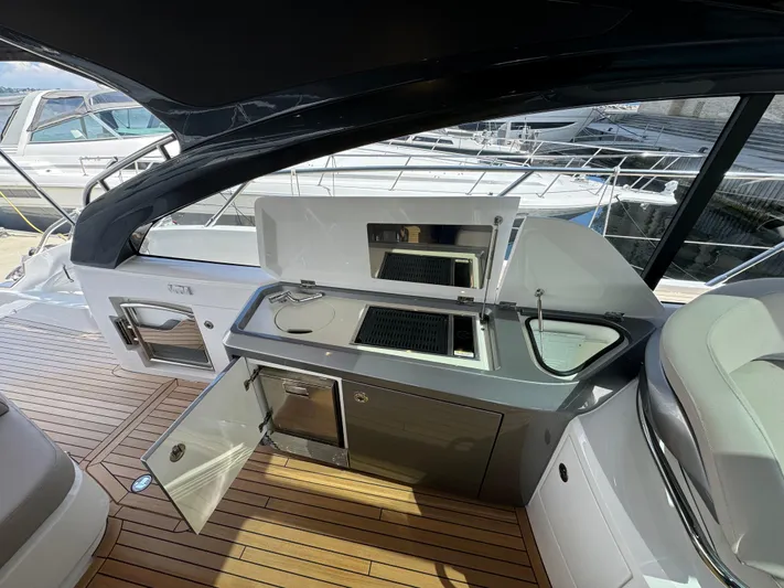  Yacht Photos Pics 2023 Princess V50 Open yacht with sleek outdoor kitchen and modern amenities.