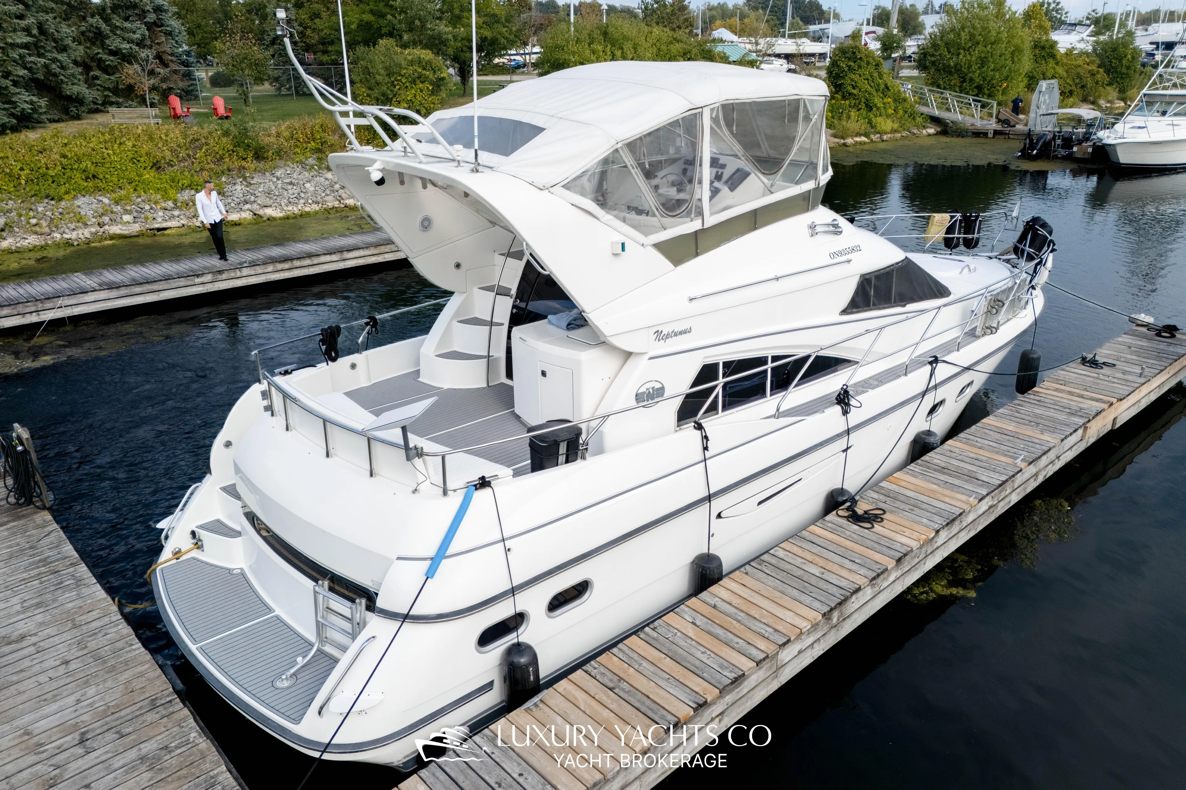  Yacht Photos Pics 1997 Neptunus 50 Aft Cabin yacht docked at marina, luxury vessel.