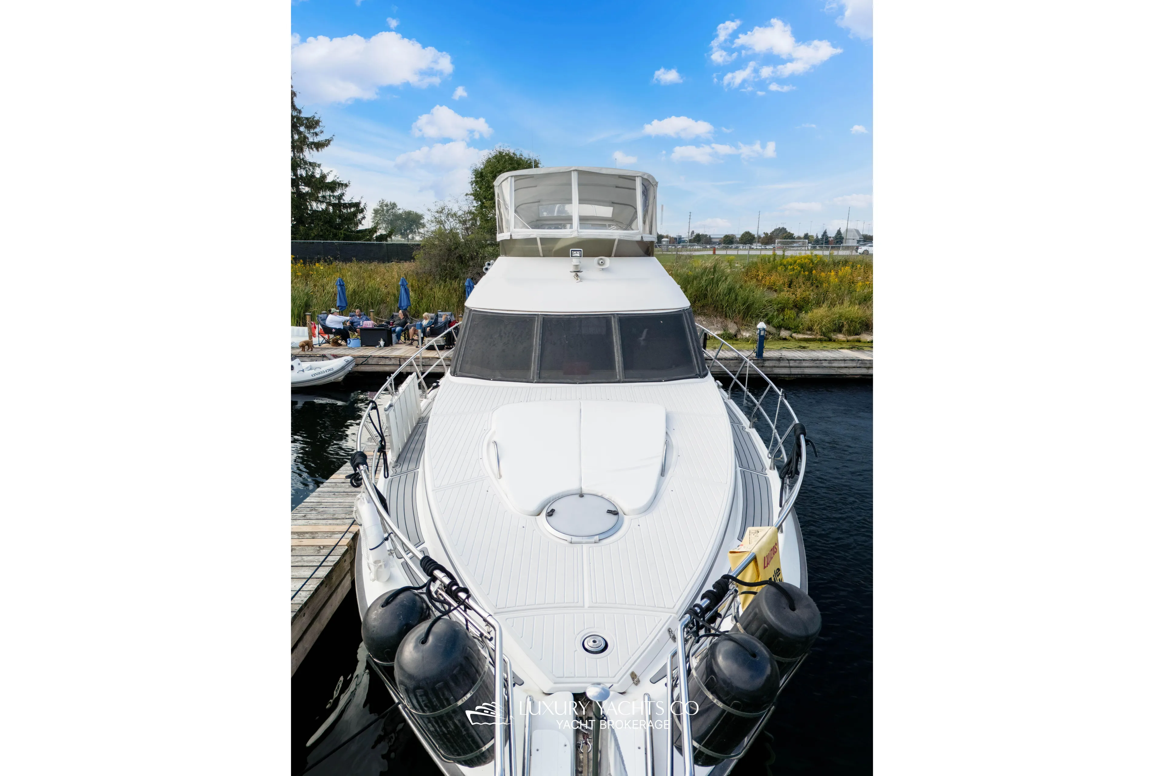  Yacht Photos Pics 1997 Neptunus 50 Aft Cabin yacht docked, featuring sleek design and spacious deck.