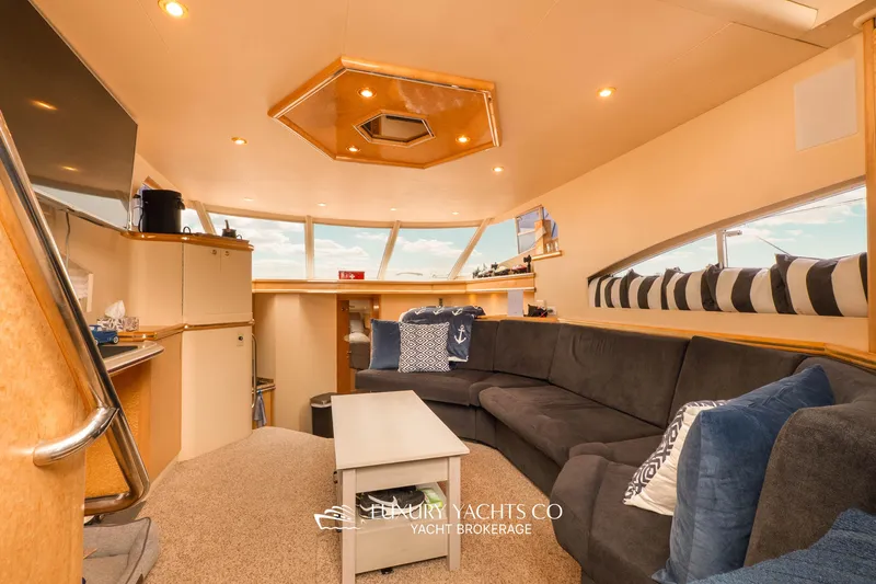  Yacht Photos Pics Luxurious interior of 1997 Neptunus 50 Aft Cabin yacht with plush seating and modern decor.