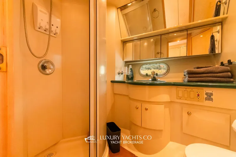  Yacht Photos Pics Luxurious bathroom in 1997 Neptunus 50 Aft Cabin yacht with shower and vanity.