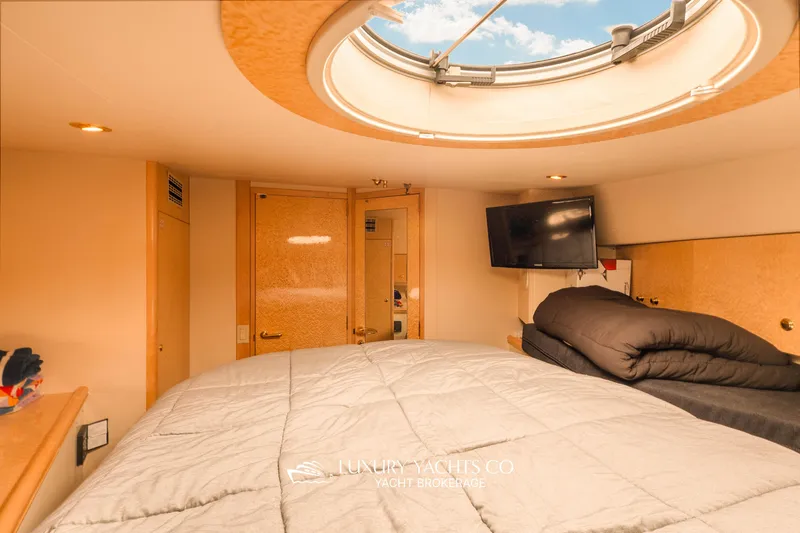  Yacht Photos Pics Luxurious 1997 Neptunus 50 Aft Cabin interior with skylight and modern amenities.