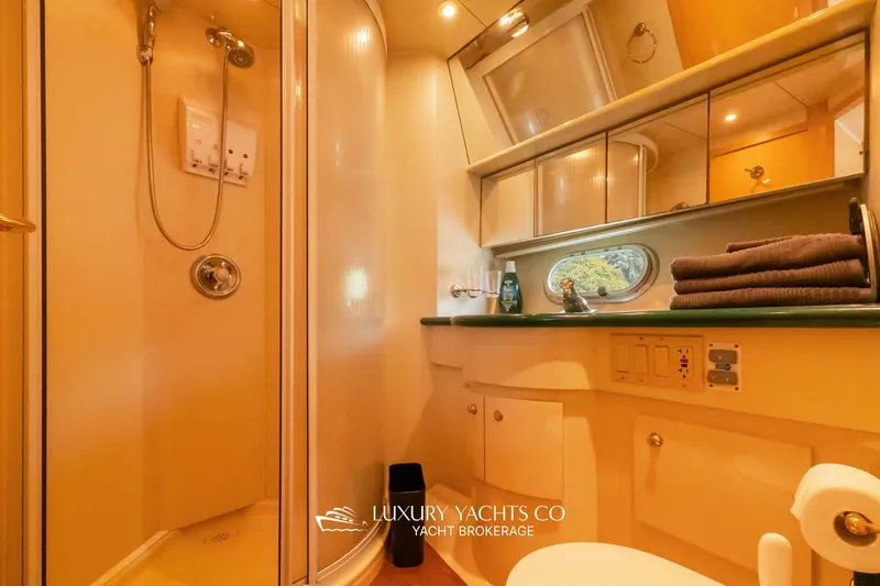  Yacht Photos Pics Luxurious bathroom in 1997 Neptunus 50 Aft Cabin yacht with shower and vanity.