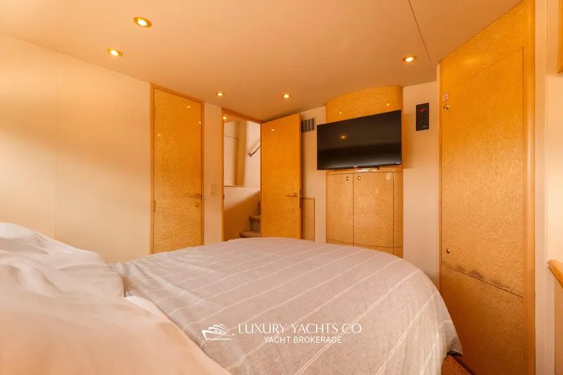  Yacht Photos Pics Luxurious bedroom in 1997 Neptunus 50 Aft Cabin yacht with modern amenities.