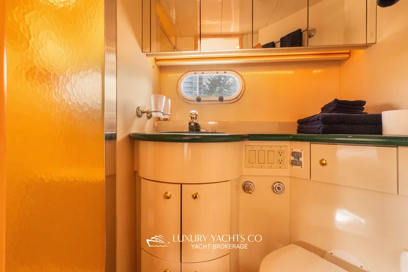  Yacht Photos Pics Luxurious bathroom in 1997 Neptunus 50 Aft Cabin yacht with elegant fixtures.