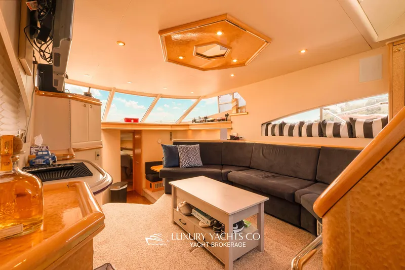  Yacht Photos Pics Luxurious interior of 1997 Neptunus 50 Aft Cabin yacht with plush seating and modern amenities.