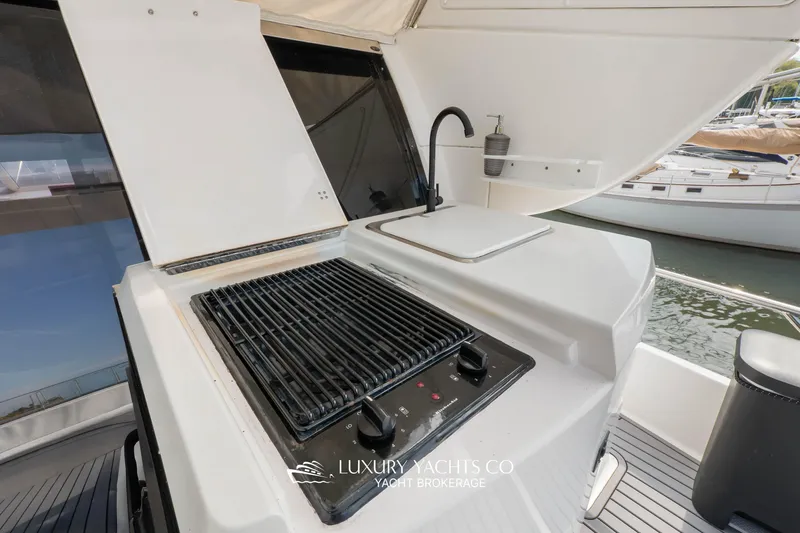  Yacht Photos Pics Outdoor grill and sink on 1997 Neptunus 50 Aft Cabin yacht deck.