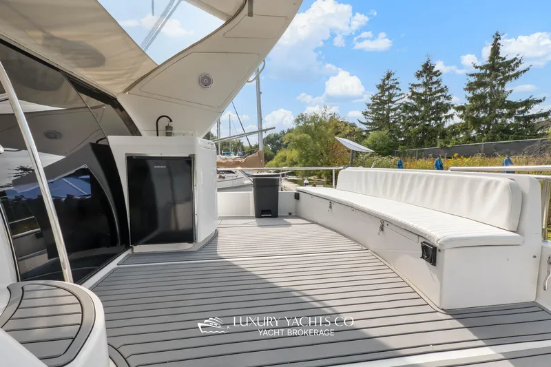  Yacht Photos Pics 1997 Neptunus 50 Aft Cabin yacht deck with seating and outdoor amenities.