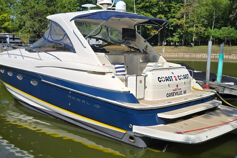  Yacht Photos Pics 2003 Regal Commodore 4260 yacht docked, featuring blue and white design, located in Caseville, MI.