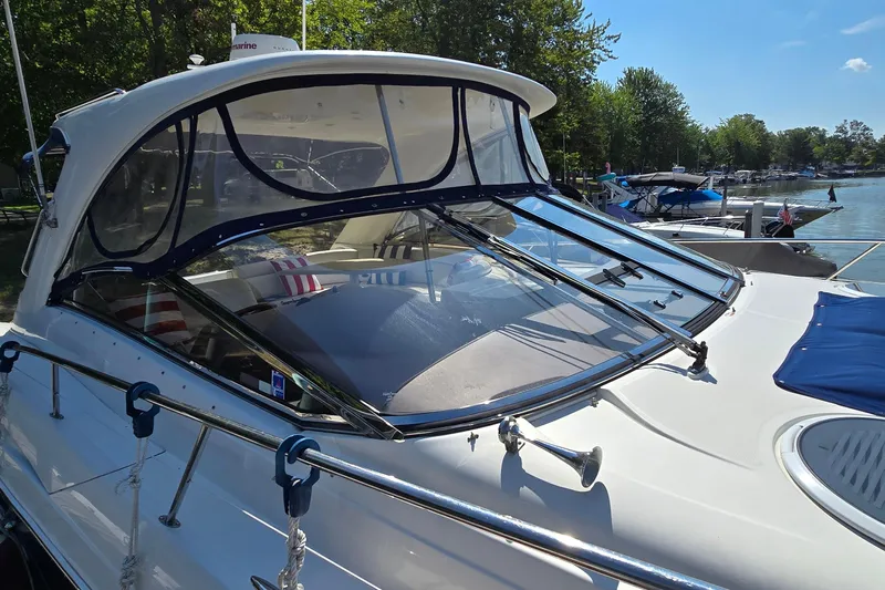  Yacht Photos Pics 2003 Regal Commodore 4260 yacht docked, featuring sleek design and spacious cockpit.