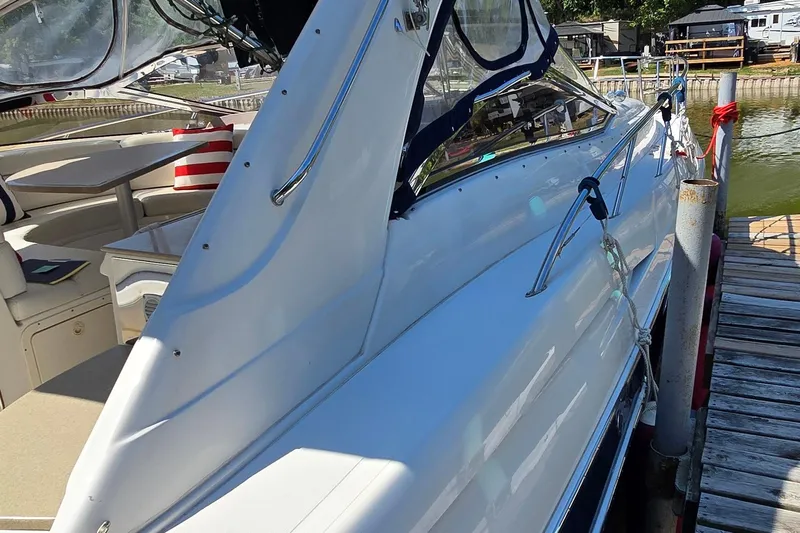  Yacht Photos Pics 2003 Regal Commodore 4260 yacht docked, showcasing sleek design and spacious interior.