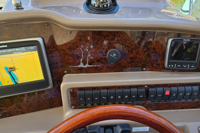  Yacht Photos Pics 2003 Regal Commodore 4260 dashboard with navigation screens and control panel.