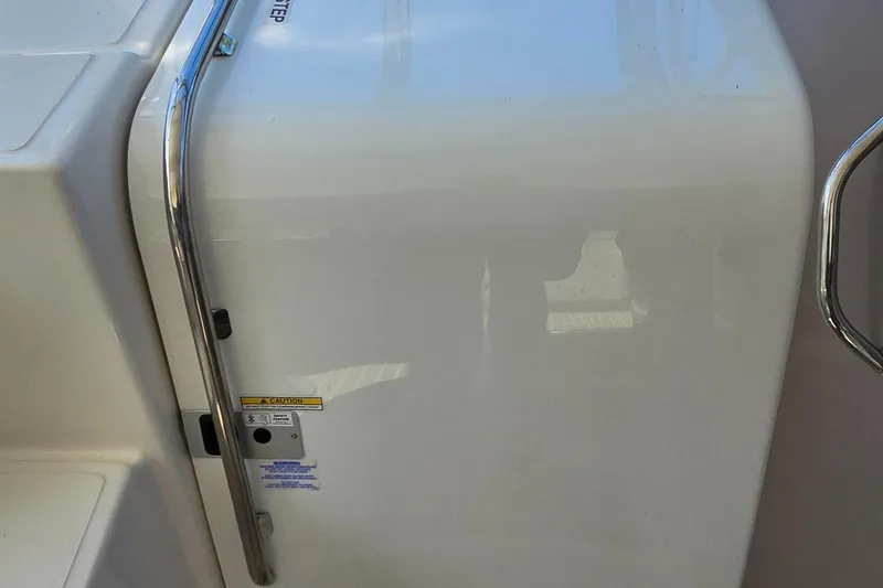 Yacht Photos Pics 2003 Regal Commodore 4260 boat interior with stainless steel handrail and caution label.