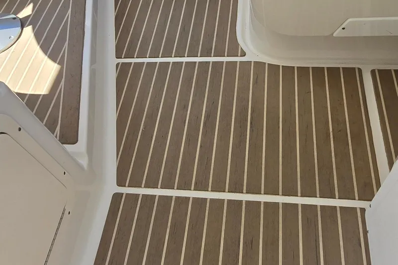  Yacht Photos Pics Teak-patterned deck flooring on a 2003 Regal Commodore 4260 boat.