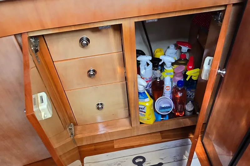  Yacht Photos Pics Cabinet in 2003 Regal Commodore 4260 yacht with cleaning supplies and drawers.