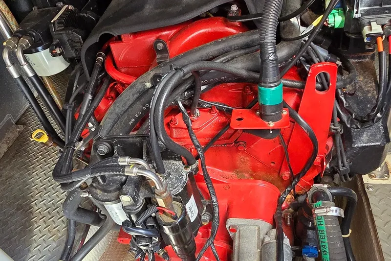  Yacht Photos Pics Engine compartment of a 2003 Regal Commodore 4260 boat, featuring red engine components.