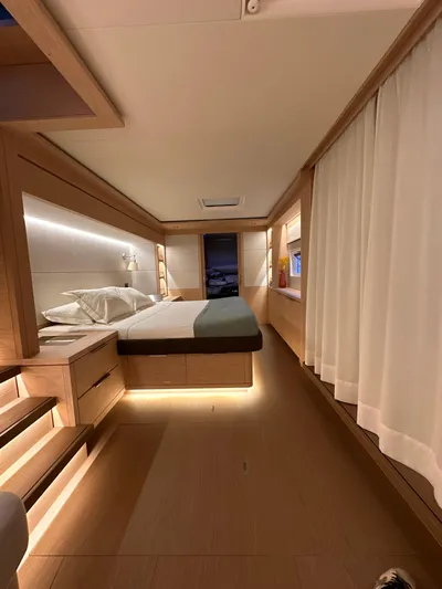 Kajikia Yacht Photos Pics Luxurious 2023 Lagoon 77 yacht cabin with modern design and ambient lighting.