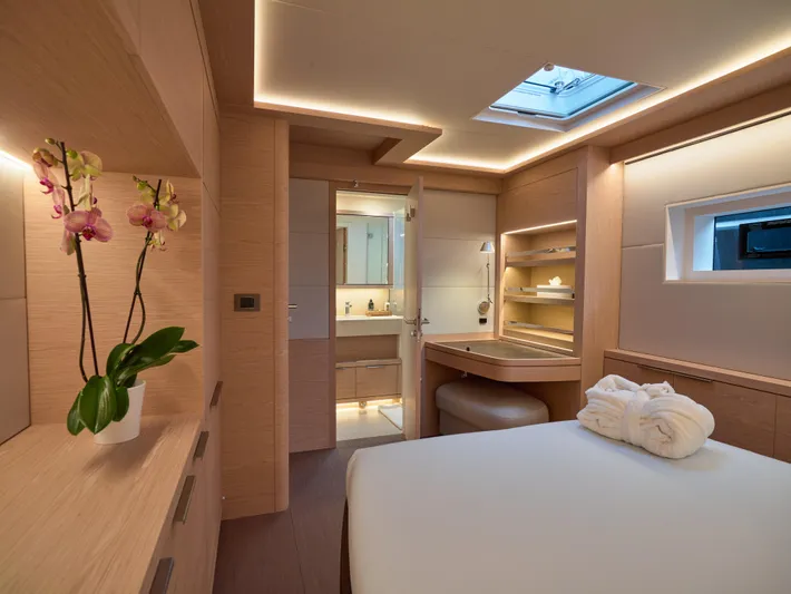 Kajikia Yacht Photos Pics Luxurious interior of 2023 Lagoon 77 yacht cabin with modern design and elegant lighting.