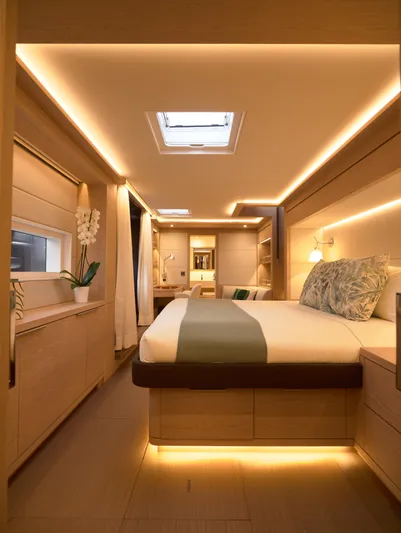 Kajikia Yacht Photos Pics Luxurious interior of 2023 Lagoon 77 yacht with modern lighting and elegant decor.
