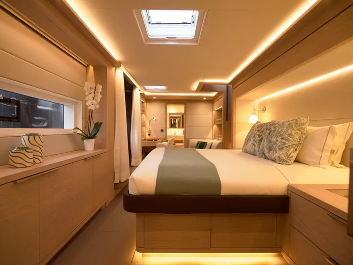 Kajikia Yacht Photos Pics Luxurious interior of 2023 Lagoon 77 yacht with elegant bedroom design.